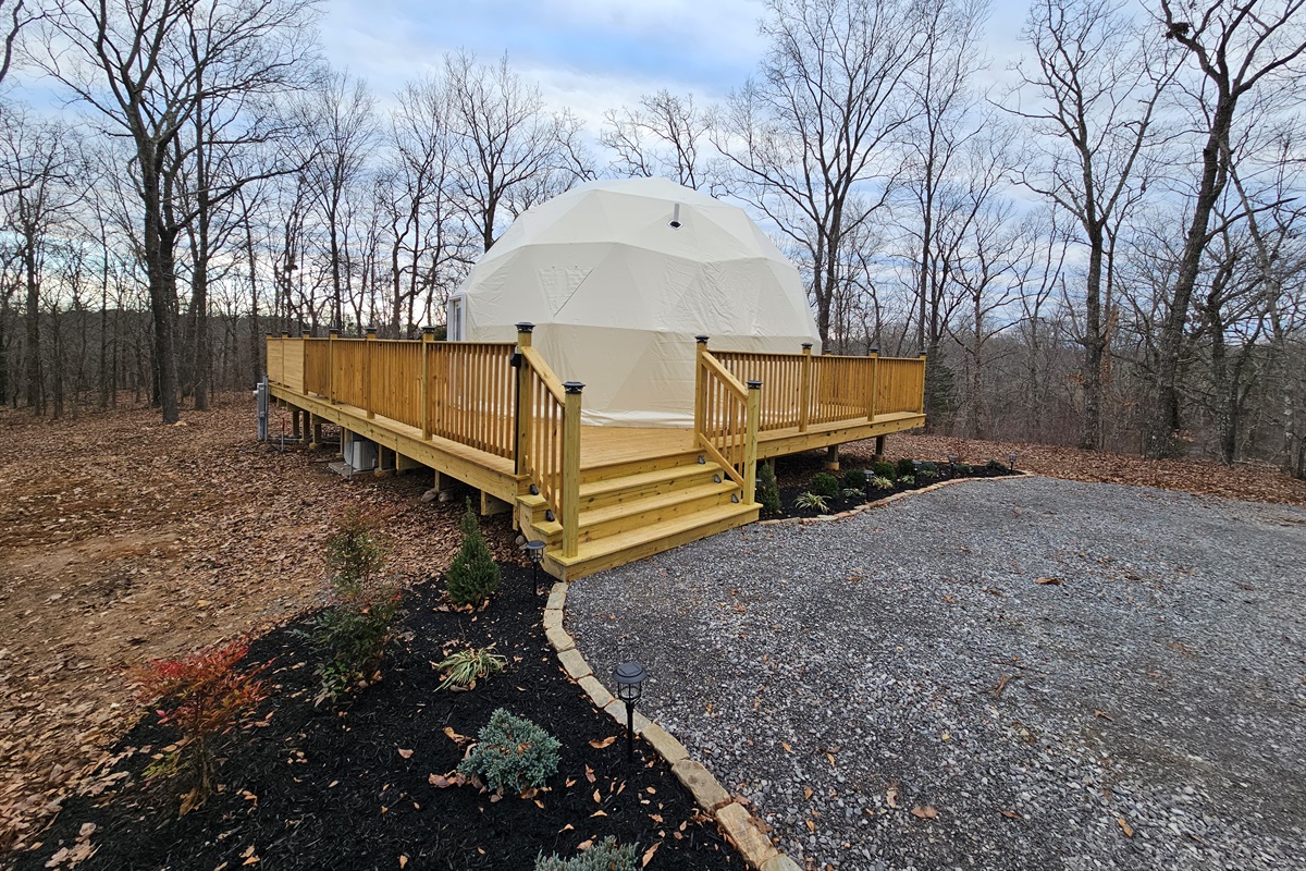 A handcrafted deck wraps your private forest dome
