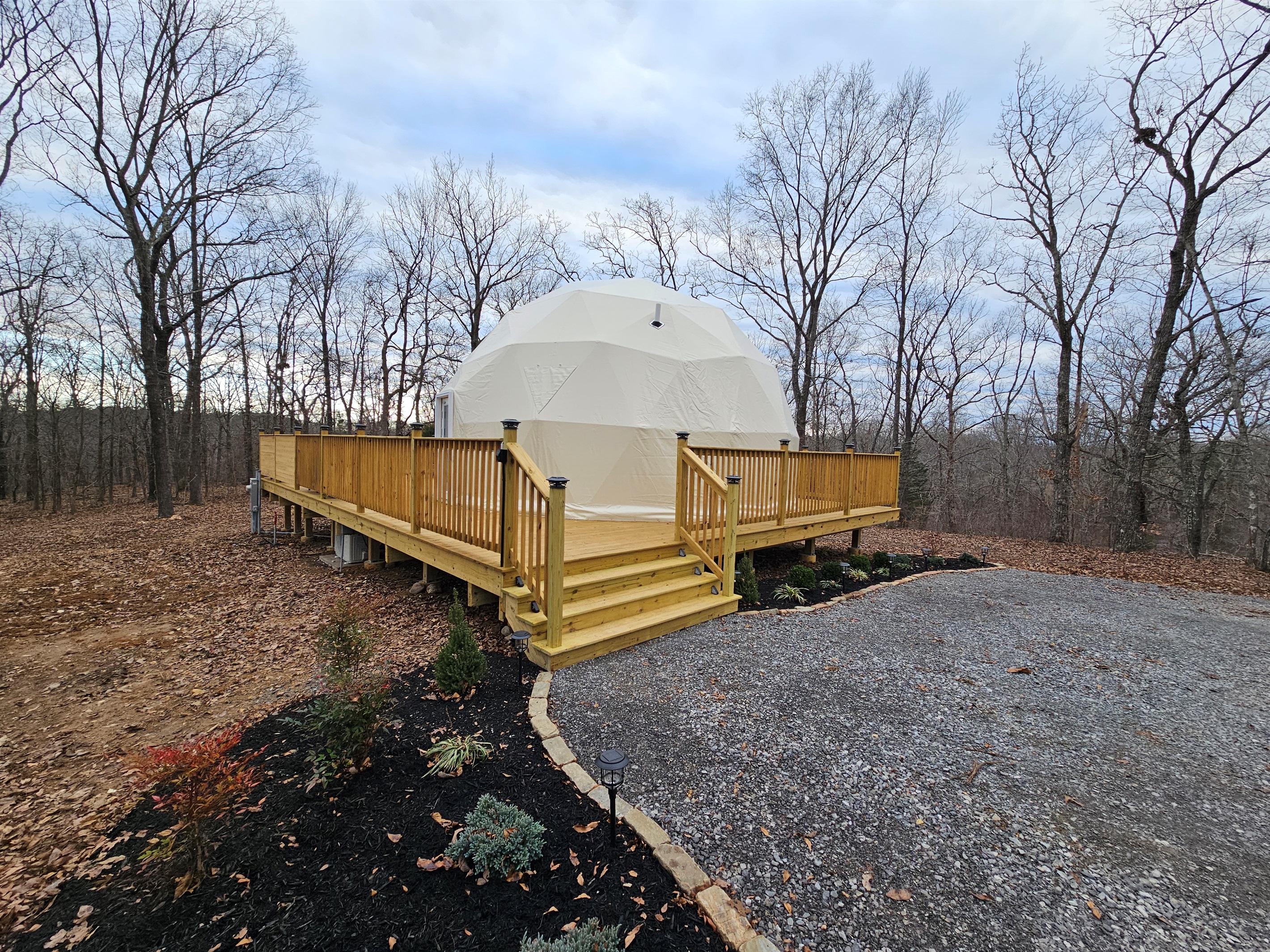 A handcrafted deck wraps your private forest dome