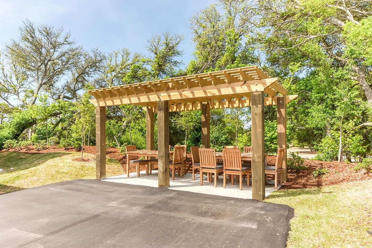 Outdoor dining under pergola — perfect for group meals