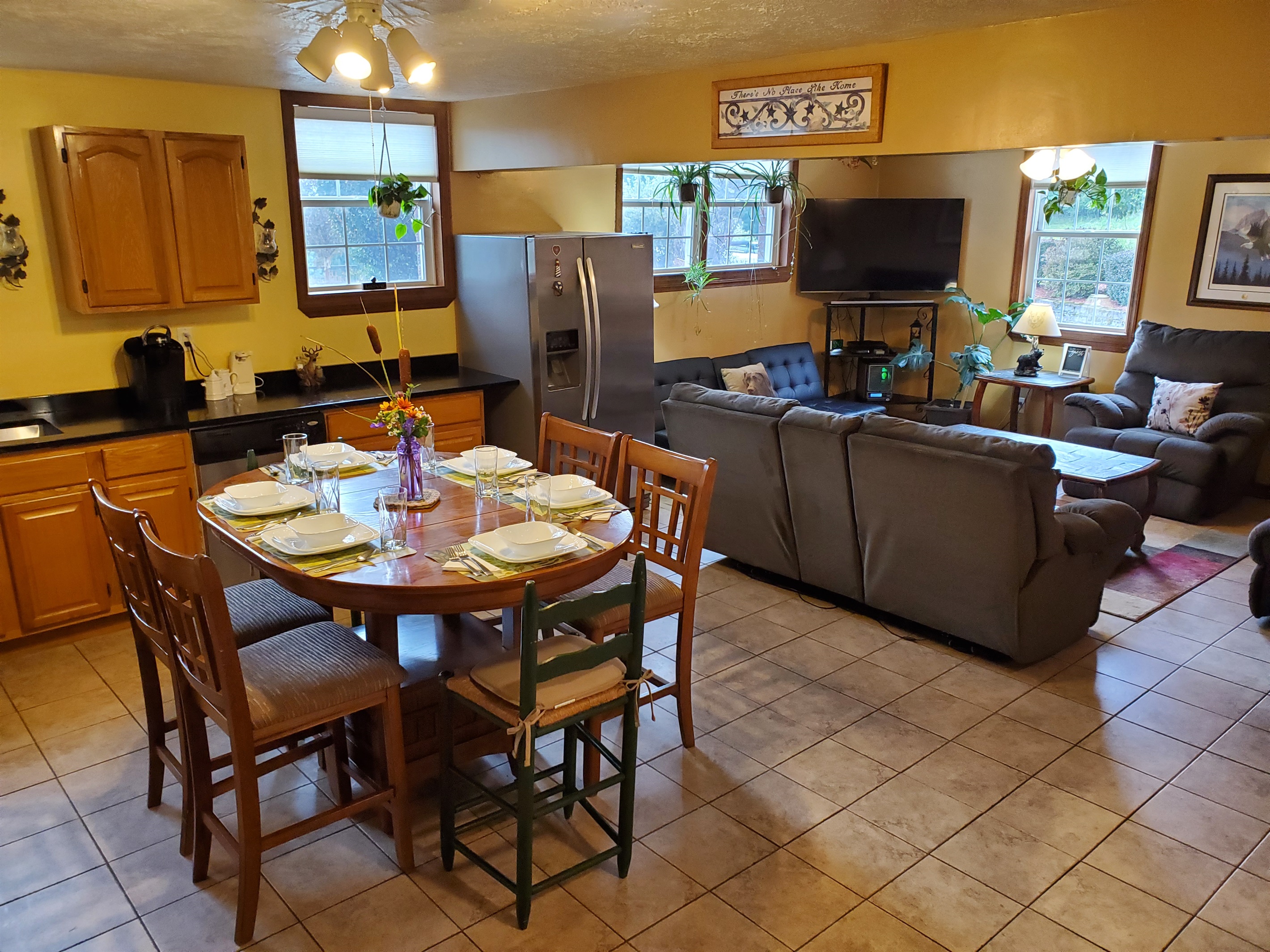 Open concept kitchen, dining, living areas