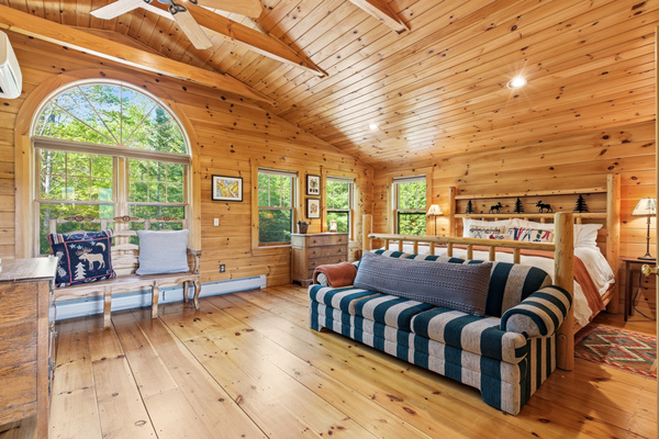 Gather in the spacious loft, featuring soaring ceilings, abundant natural light, and comfortable seating.