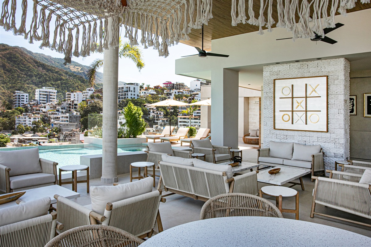 The rooftop offers plenty of comfortable seating areas—ideal for conversations, remote work, or simply enjoying the ocean breeze.