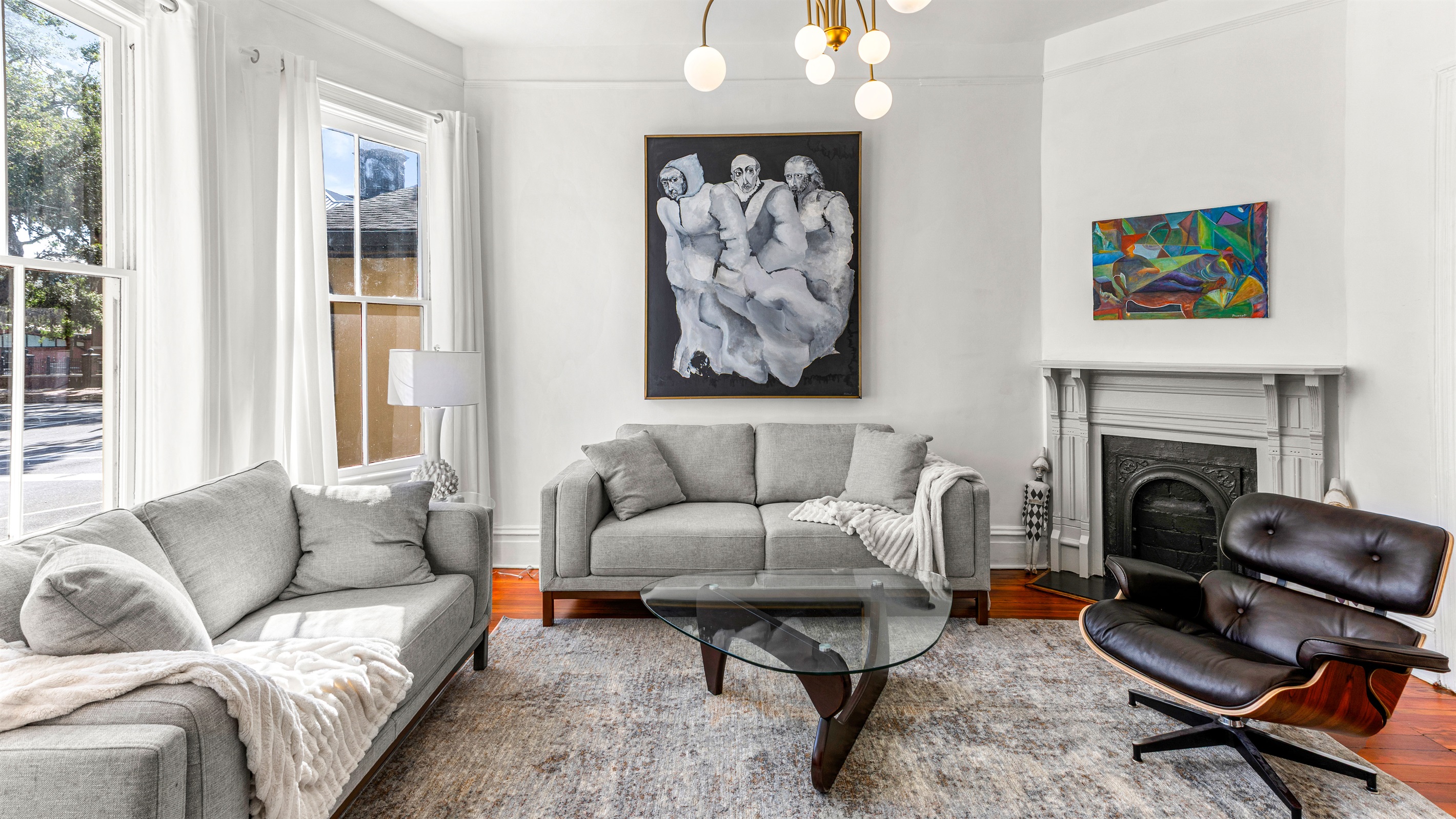 Living Room with Comfortable Seating and Original Art Work