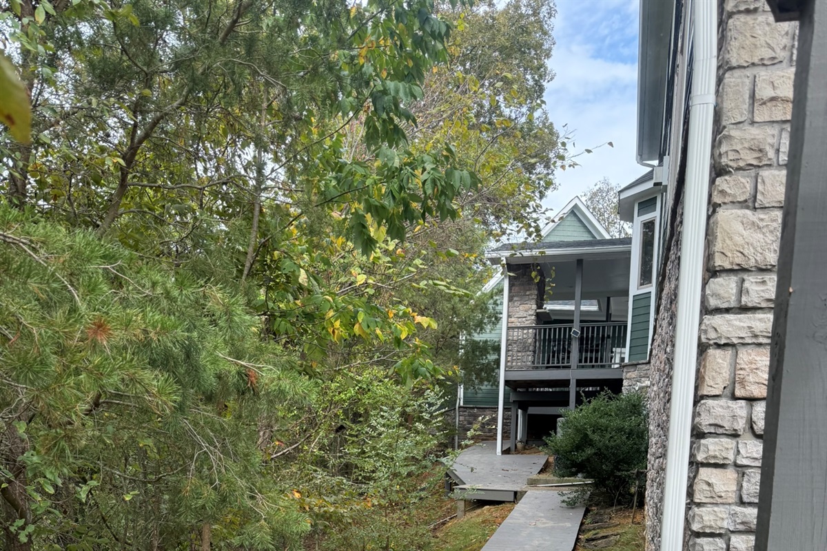 View from back of home looking at grill deck attached to front porch