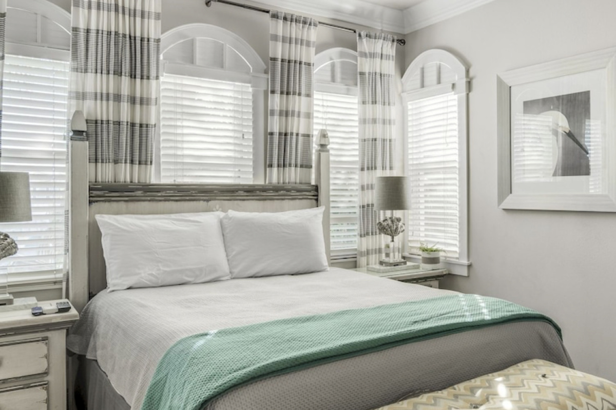 Primary Bedroom 4 with King Bed and Side Views of Gulf
