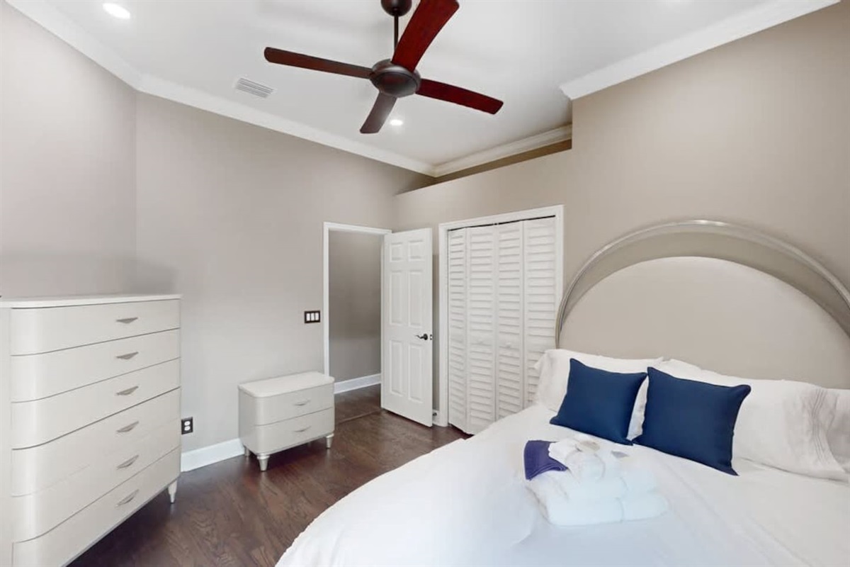 Cozy bedroom w/ soft light for a restful night.