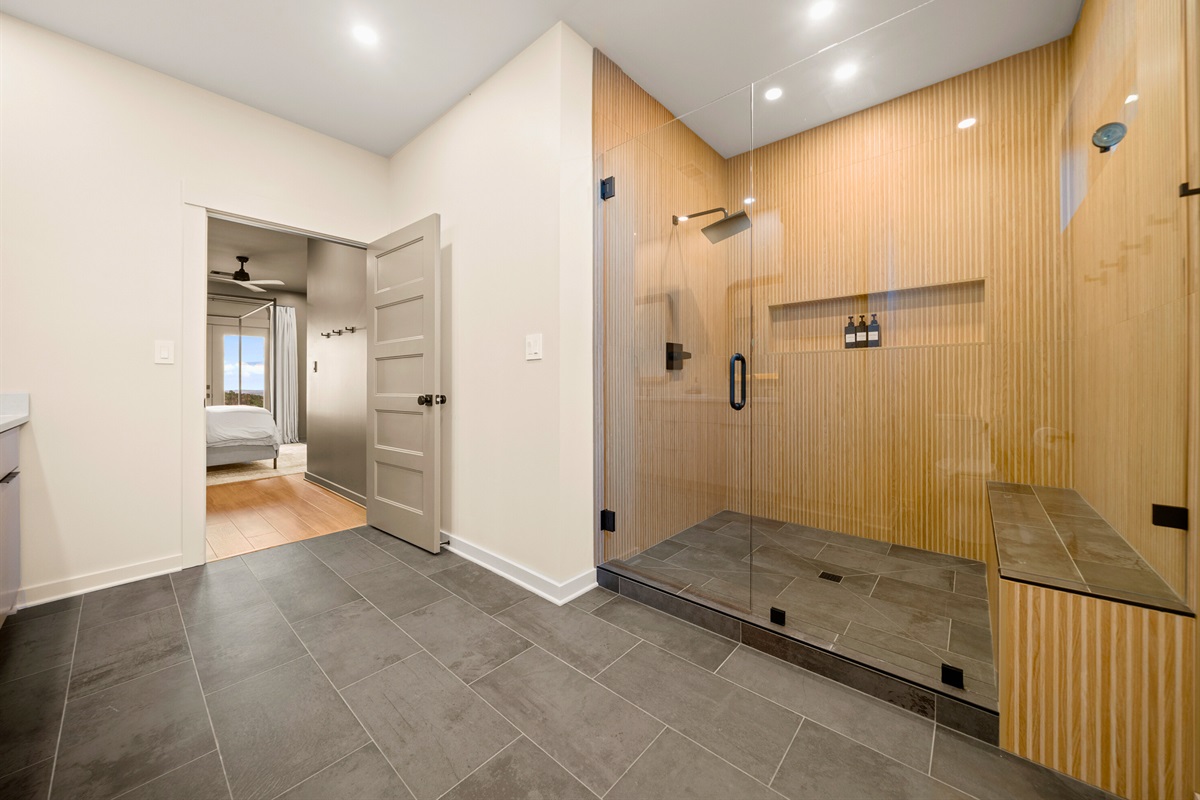 This shower setup feels spa-like and luxurious, with plenty of space to rinse off, relax, and start or end your day on a refreshing note.