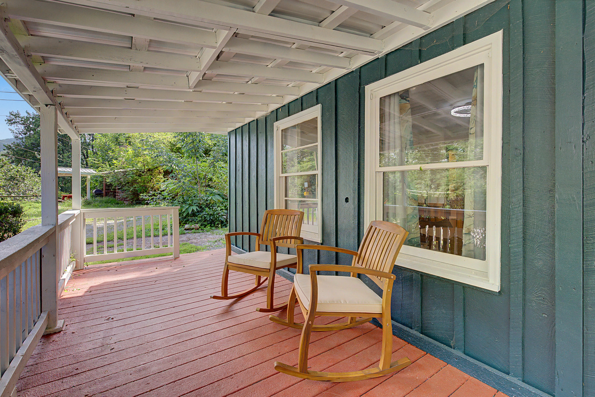 Porch Retreat: Enjoy mountain views from rocking chairs on your private outdoor escape!