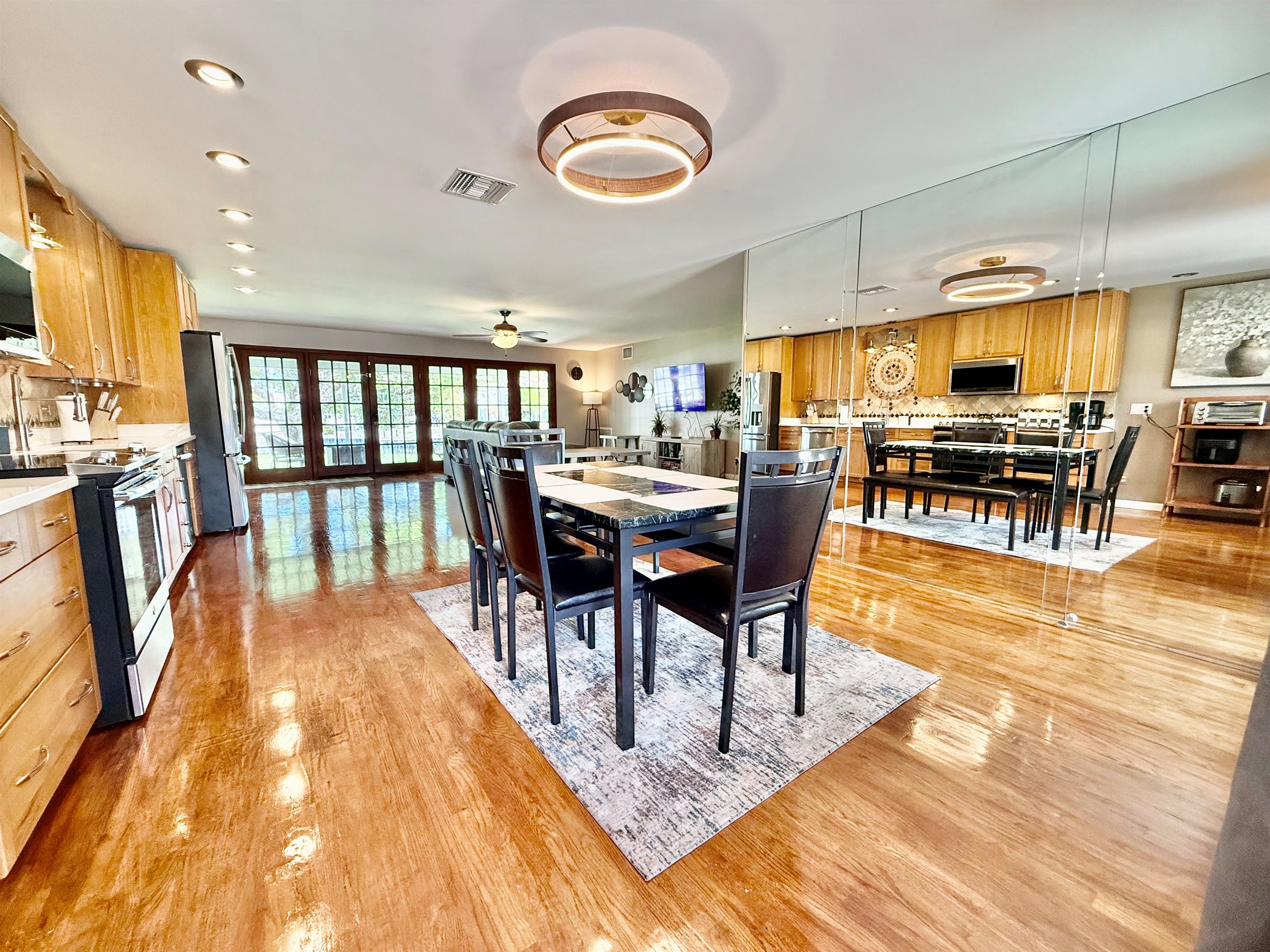 Enjoy meals together in this beautifully designed dining area, set within an open floor plan that flows seamlessly from kitchen to living room—perfect for both casual bites and special gatherings.