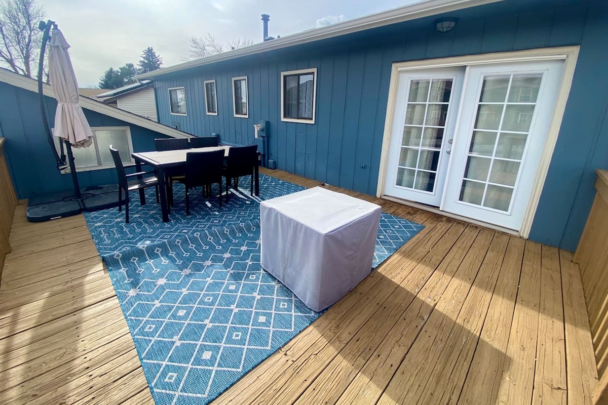 Private patio with fire pit, table and grill