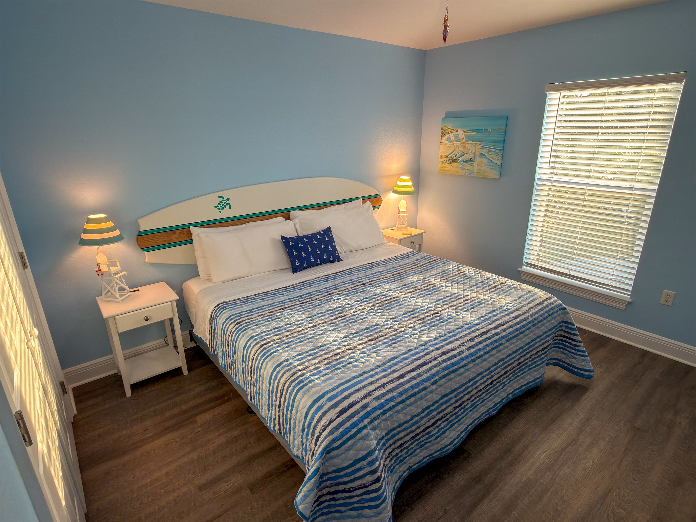 Second Floor Bedroom 3 brings a bright coastal feel with soft ocean-blue tones, beach-inspired décor, and a cozy space designed for restful nights.