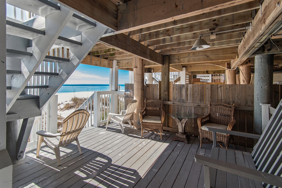 Ground Level BeachFront Patio - seating, outdoor shower, and beach gear storage - perfect place to escape the sun and find some shade!