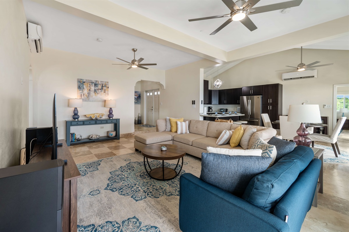 Relax on plush sofas while enjoying the sea breeze flowing through.