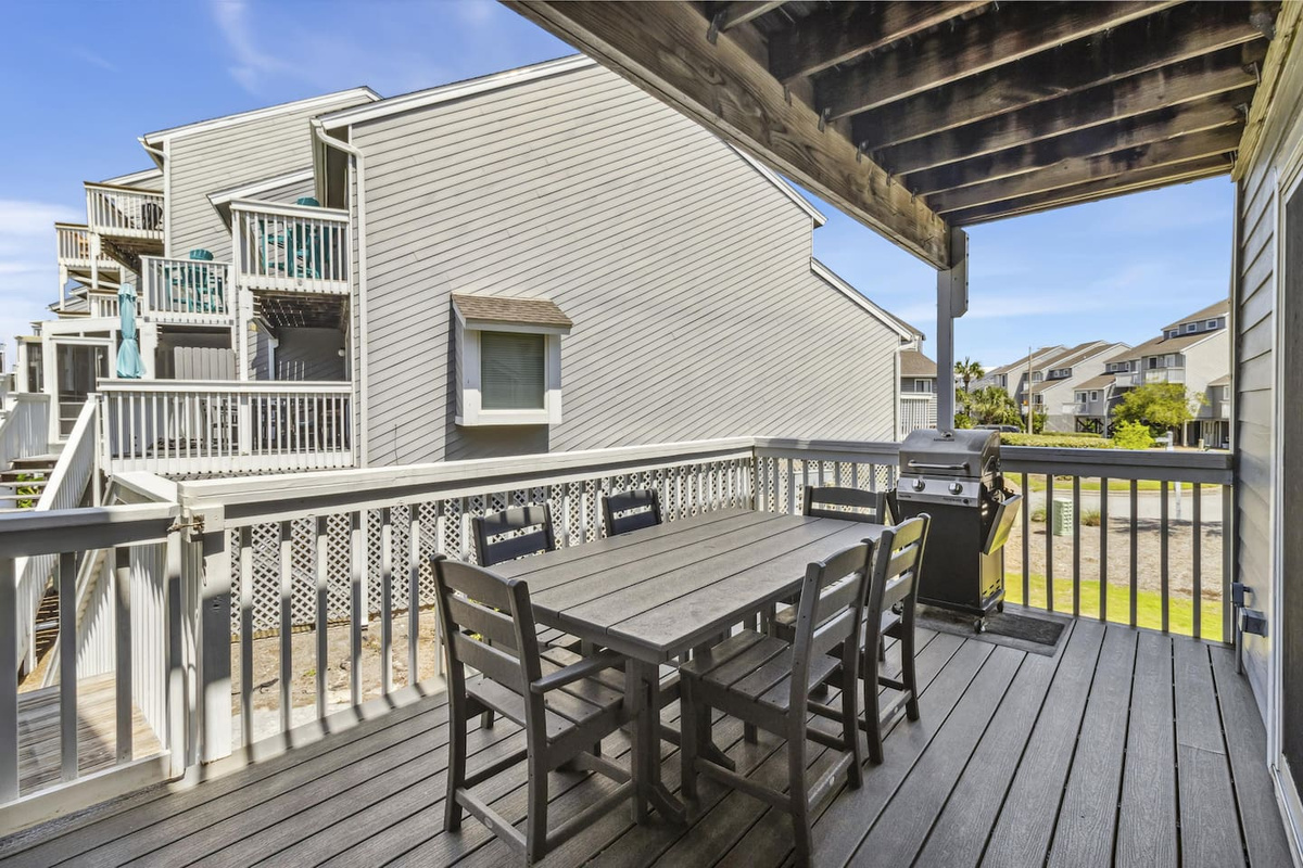 Gather the group on the oversized deck for sunset cocktails &mdash; this is what vacation looks like.