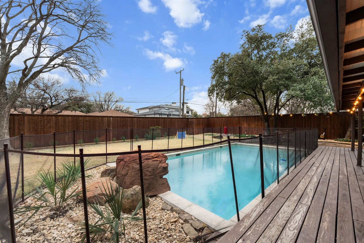Take a dip in your private pool, fully fenced for safety and surrounded by peaceful landscaping.