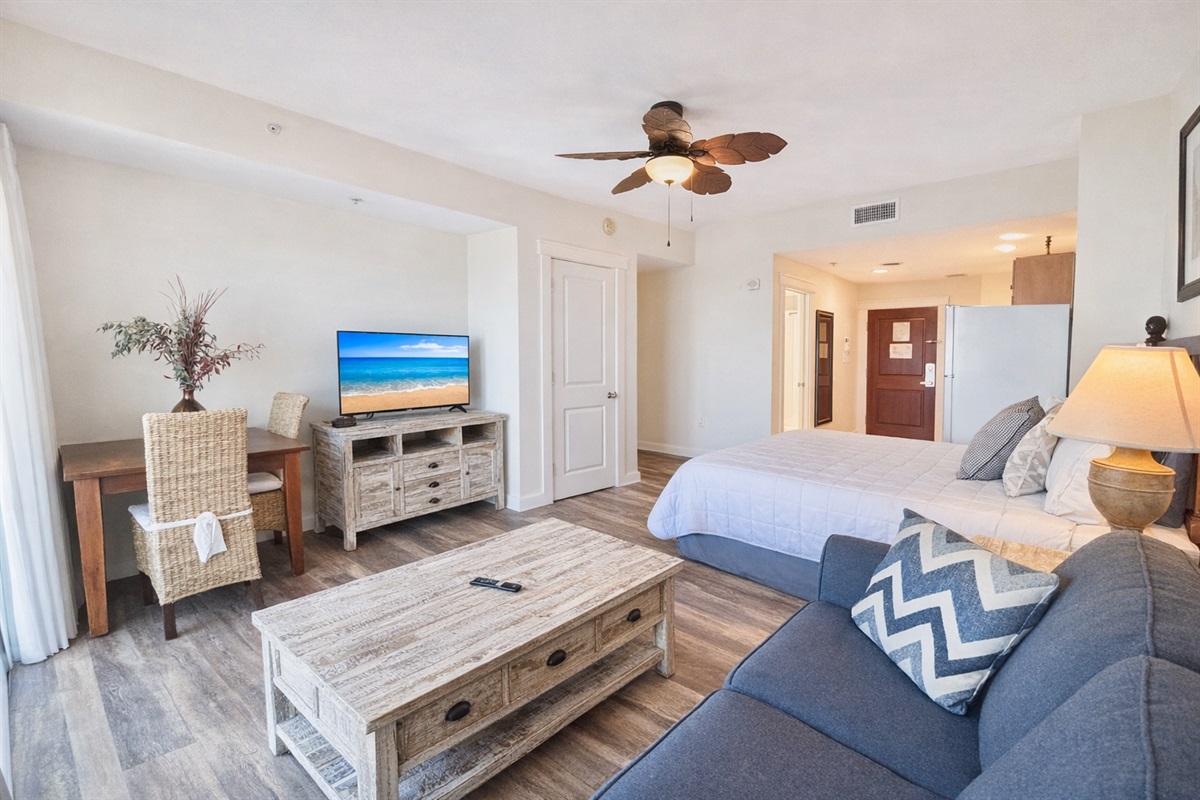 Spacious living/dining room area with TV