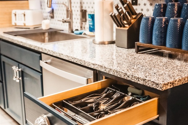 Knife block, toaster, mugs, and nice silverware. Plus a brand new Dishwasher.