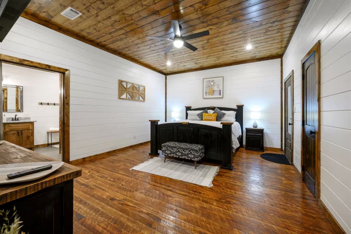 All yours: plush bedding, peaceful sleep, and a bathroom just beyond the door.