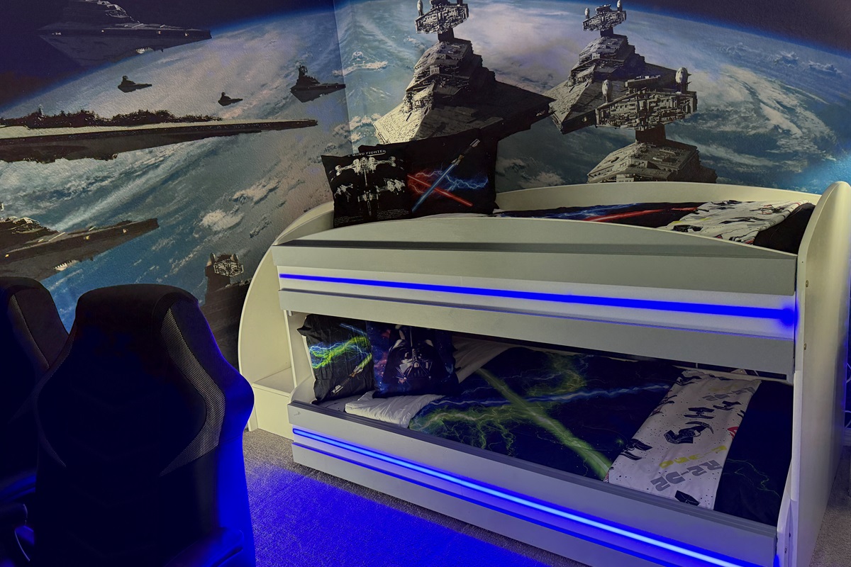 🌟🛏️ Blast off into fun in our Star Wars bunk room with LED lights, Xbox, retro games, 50” Smart TV, and safe bunk heights for kids