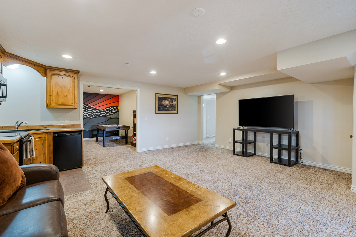 There is so much space available downstairs to gather a second group separate from the adults. Let the kids have fun!