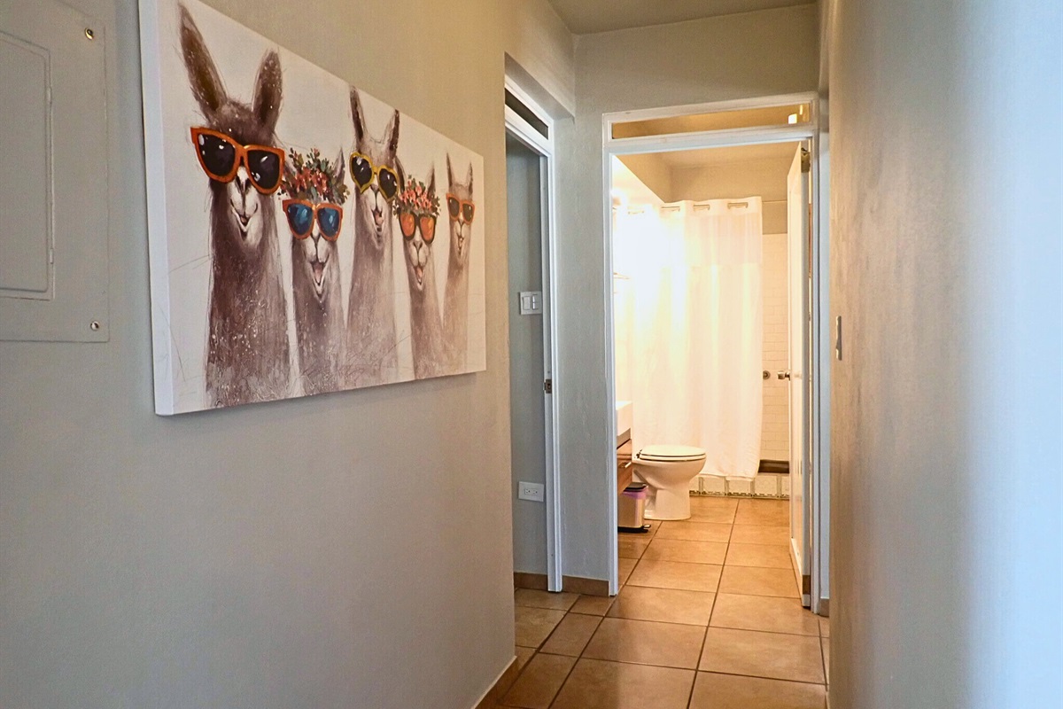 Entrance Hallway: Charming llama art greets you, setting the playful tone for your vacation!