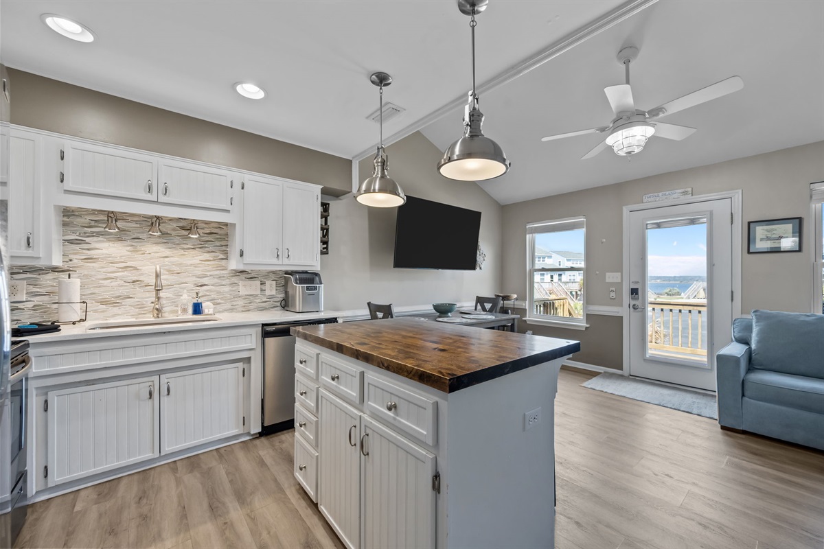Kitchen island with seating and open view to dining area