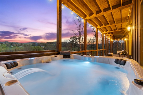 Enjoy breathtaking sunset views over rolling hills from the covered deck with glowing string lights. Magical evenings await!