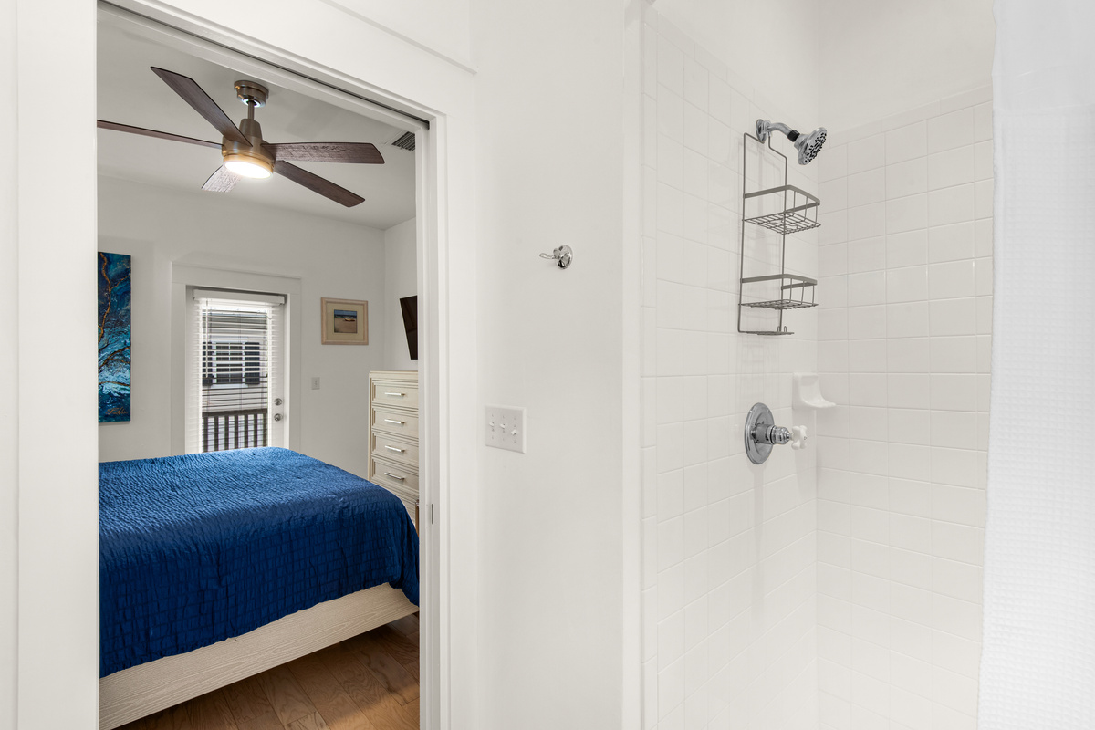 Seagrove Bungalow 103 bathroom with a walk-in shower beside the bedroom.