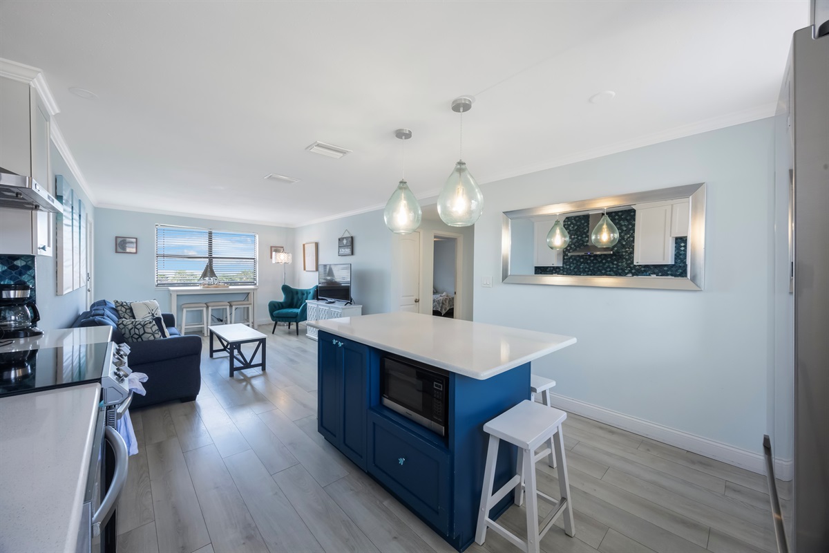 Kitchen stocked with cooking/eating/drinking utensils