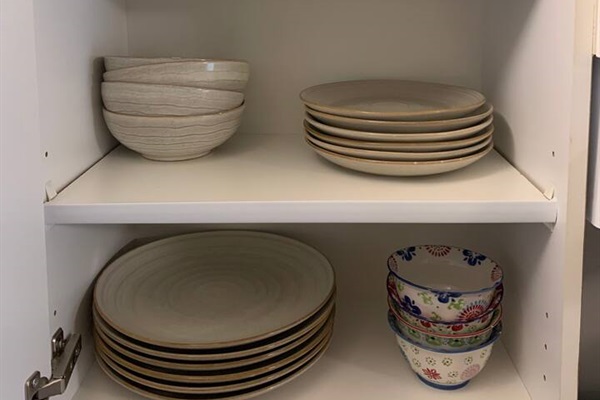 Kitchen stocked with high end stoneware
