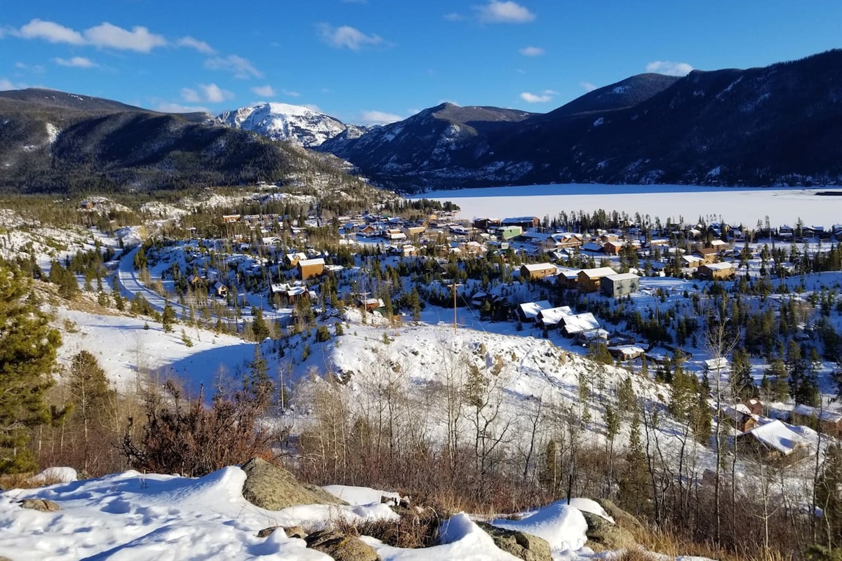 Nearby view of the town of Grand Lake, frozen Grand Lake and Mt Baldy in the background 