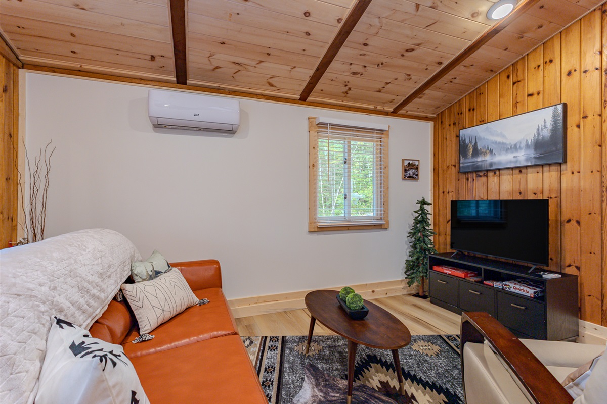 Indulge in comfort and style in our living room, featuring plush sofas, and elegant chairs. Cozy up by the fireplace, and unwind with entertainment on the TV.