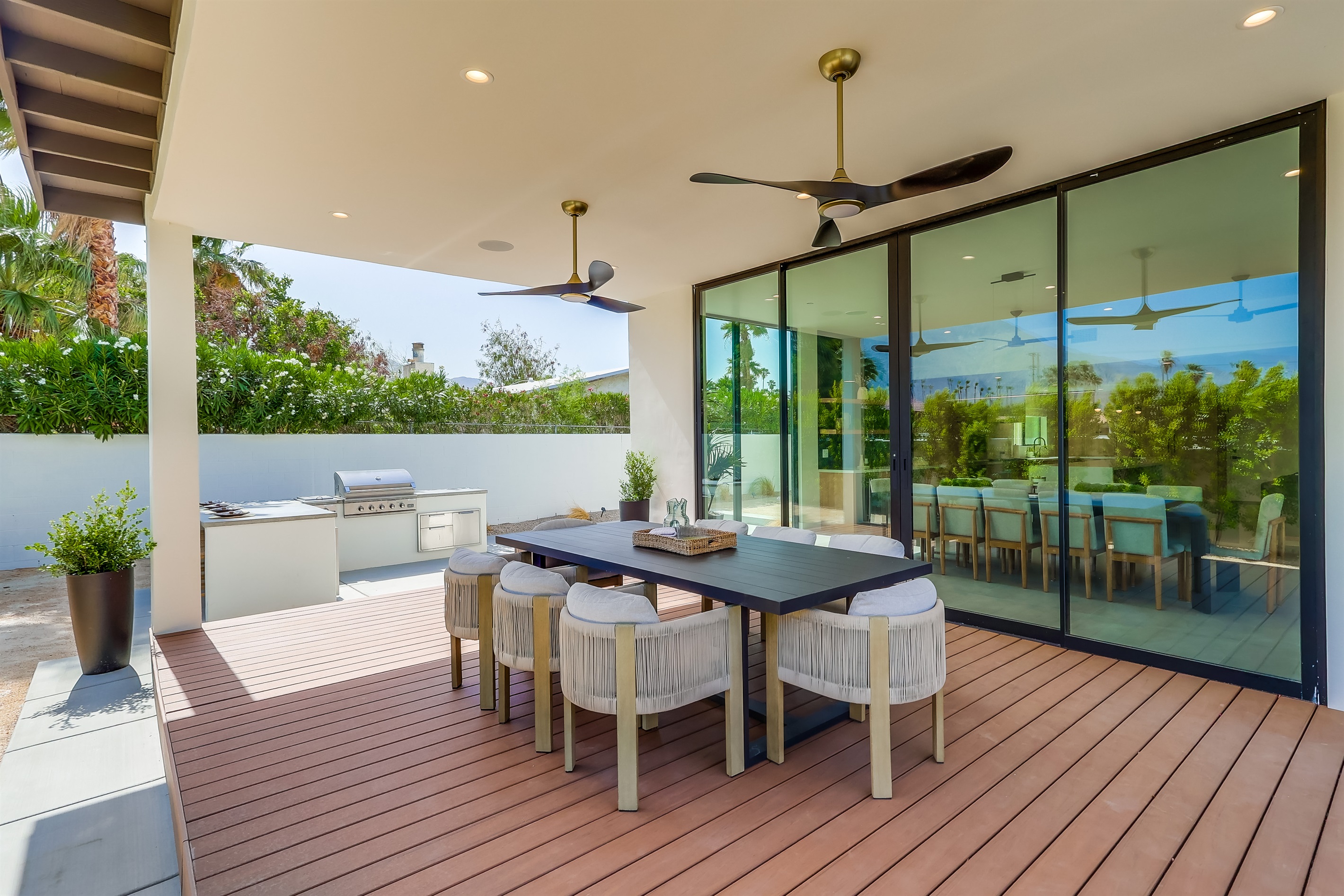 Outdoor dining under 10' canopy and equipped with ceiling fans