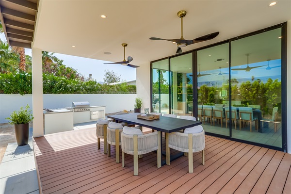 Outdoor dining under 10' canopy and equipped with ceiling fans