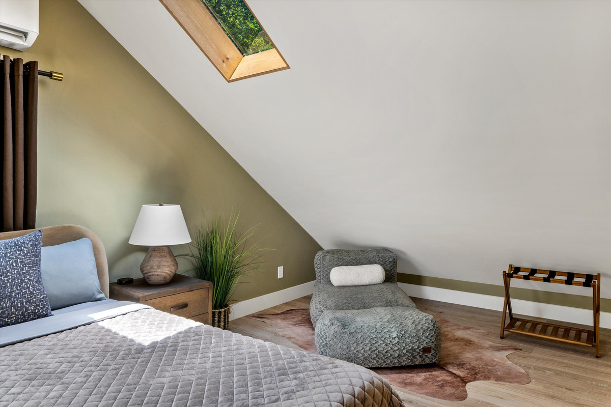 Master Bedroom with King Bed, 42-inch Smart TV, Fireplace, sound machine, blackout curtains and cozy reading chair