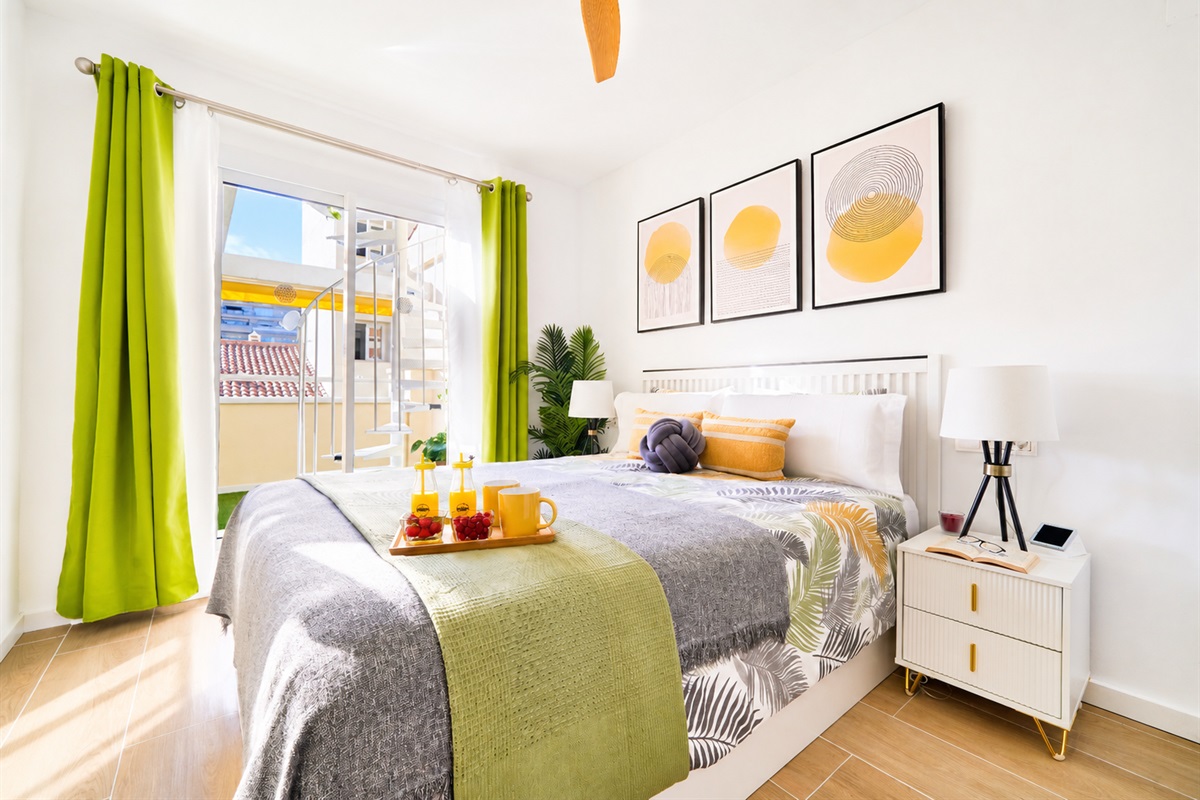 Bright and elegant master bedroom with a private terrace, walk-in wardrobe, and a serene atmosphere designed for restful nights.