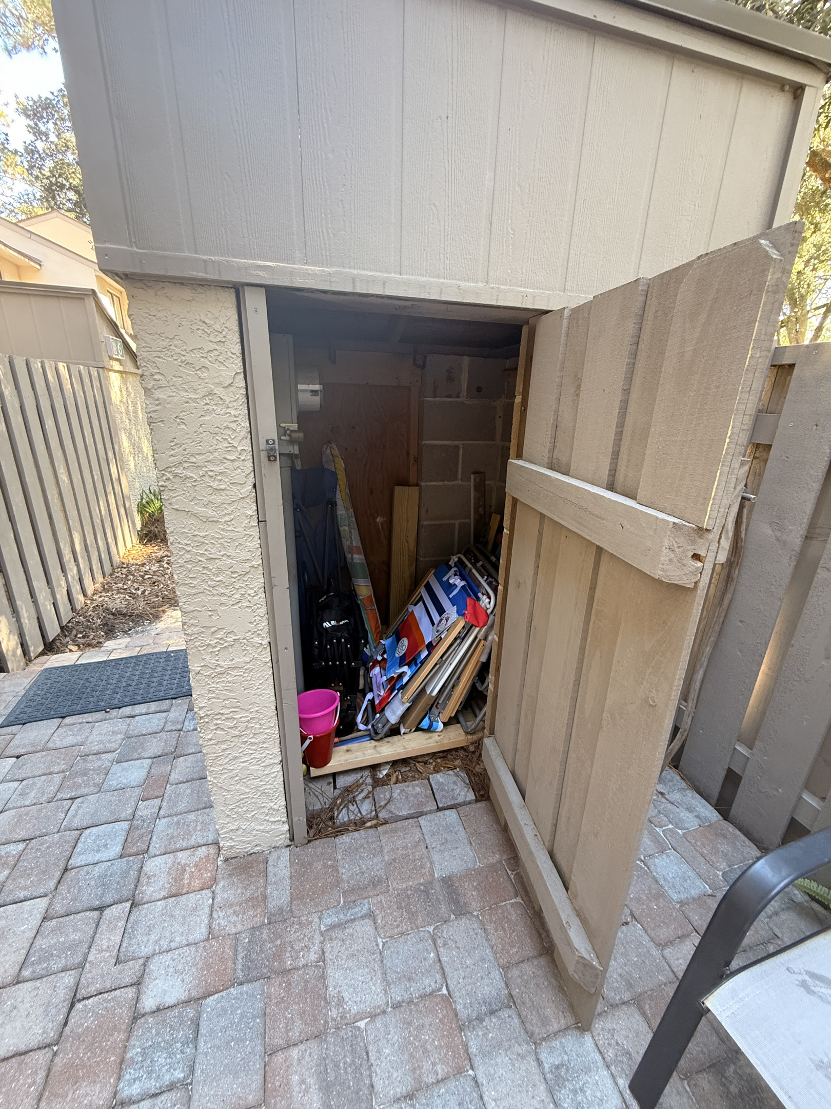 Patio storage with beach chairs and beach toys for guests
