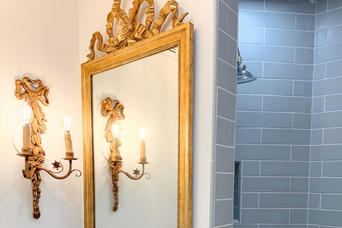 Elegant master bathroom with vintage charm and refined finishes.