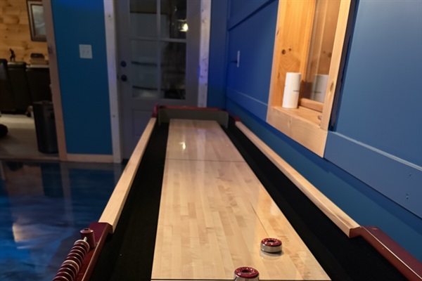 Games Room: Challenge your friends to a fun night of shuffleboard in this stylish space!

