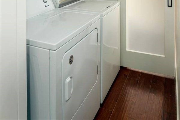 Full-size laundry.  Detergent provided (above), sliding barn door to main level half-bath.
