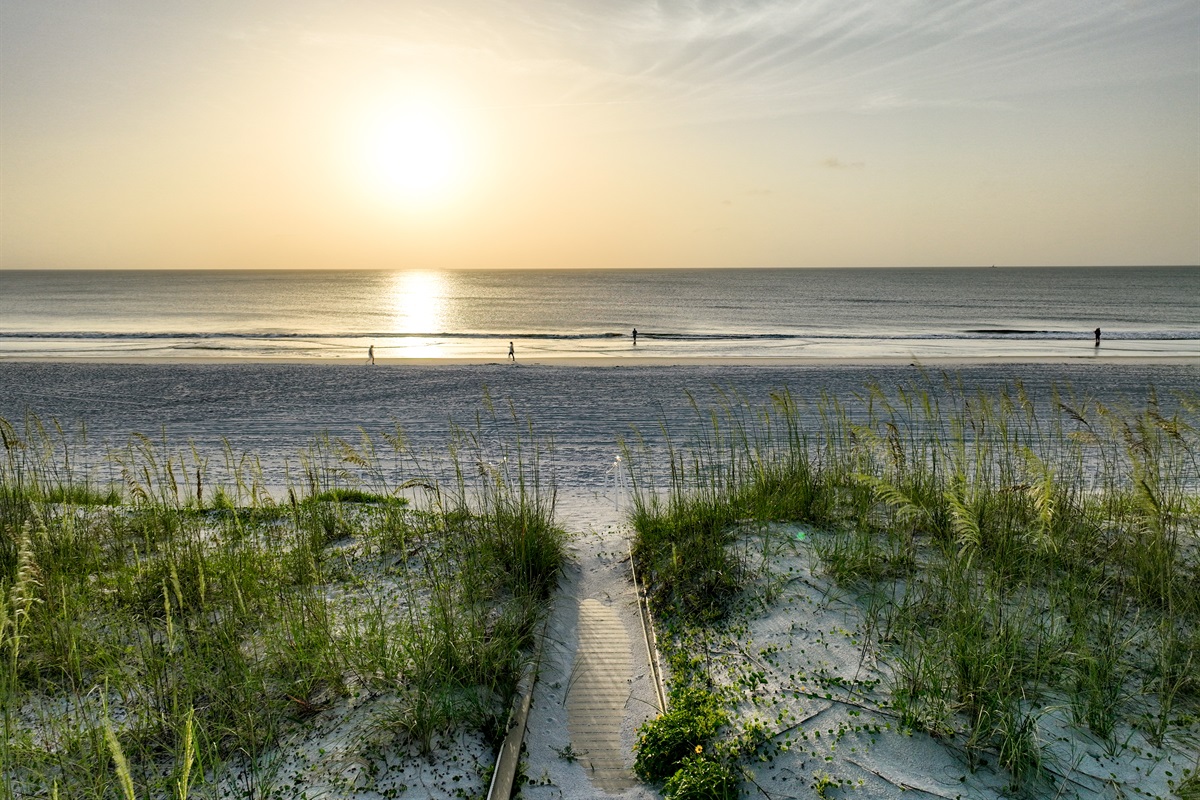 Unmatched sunrise views over the dunes and waves