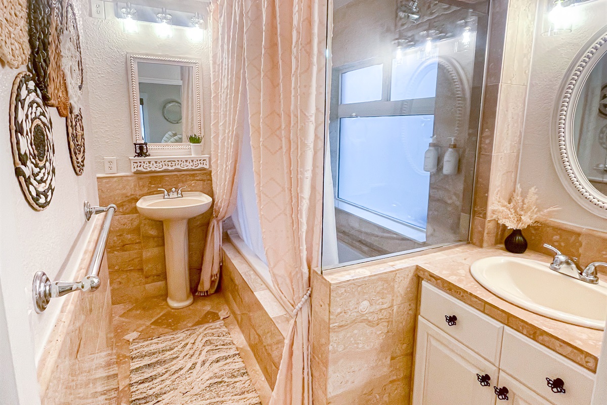 Bathroom 2 has a shower and tub combination.