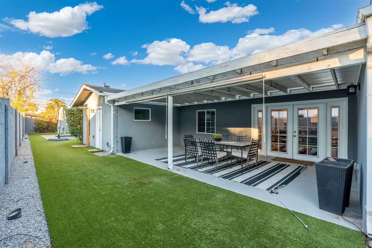 Spacious backyard, offering plenty of room for outdoor activities, relaxation, and gardening.