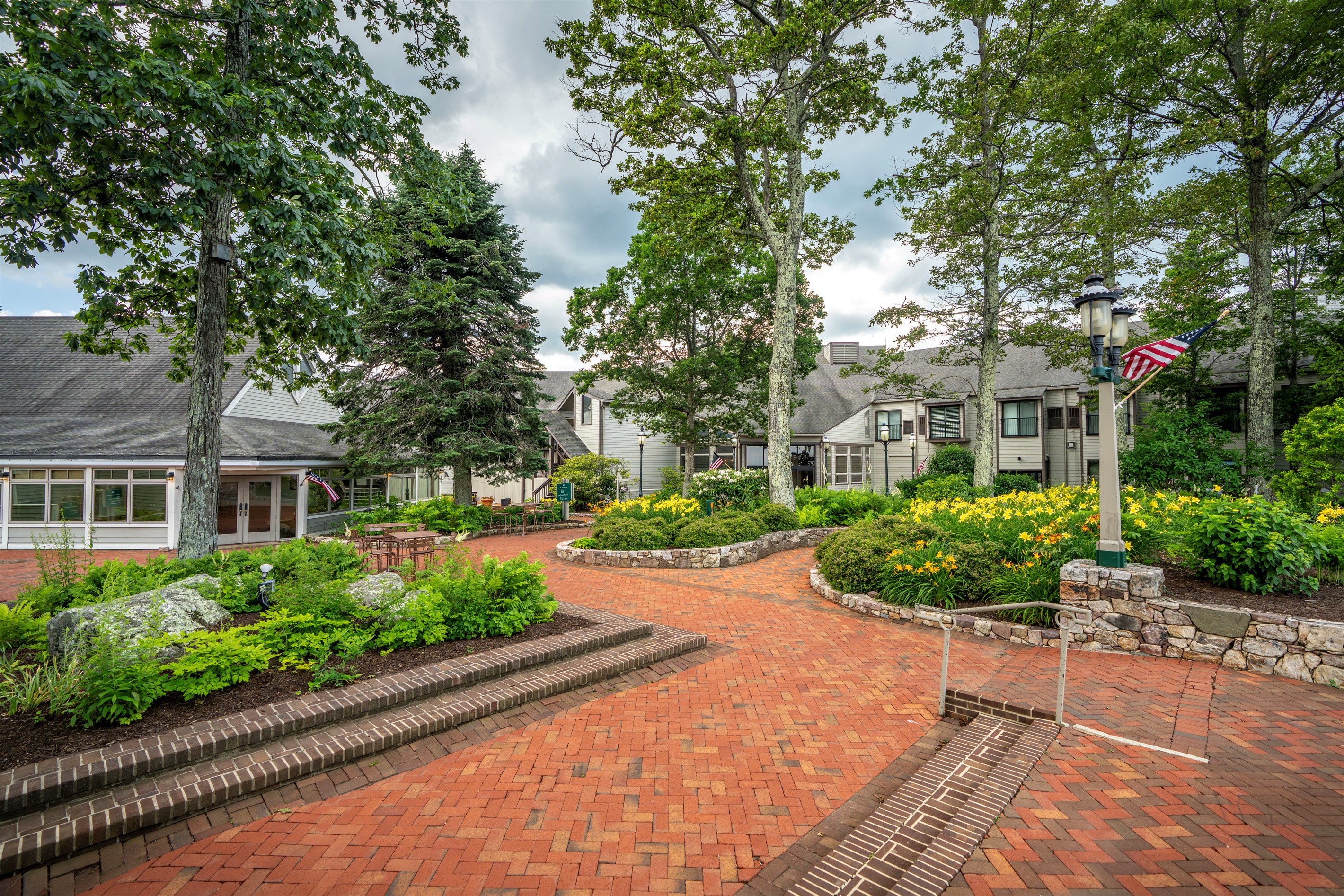 Stroll the brick courtyard of the main lodge, framed by lush gardens and mountain charm. Just steps from dining,shopping, and events—this is Wintergreen at its heart