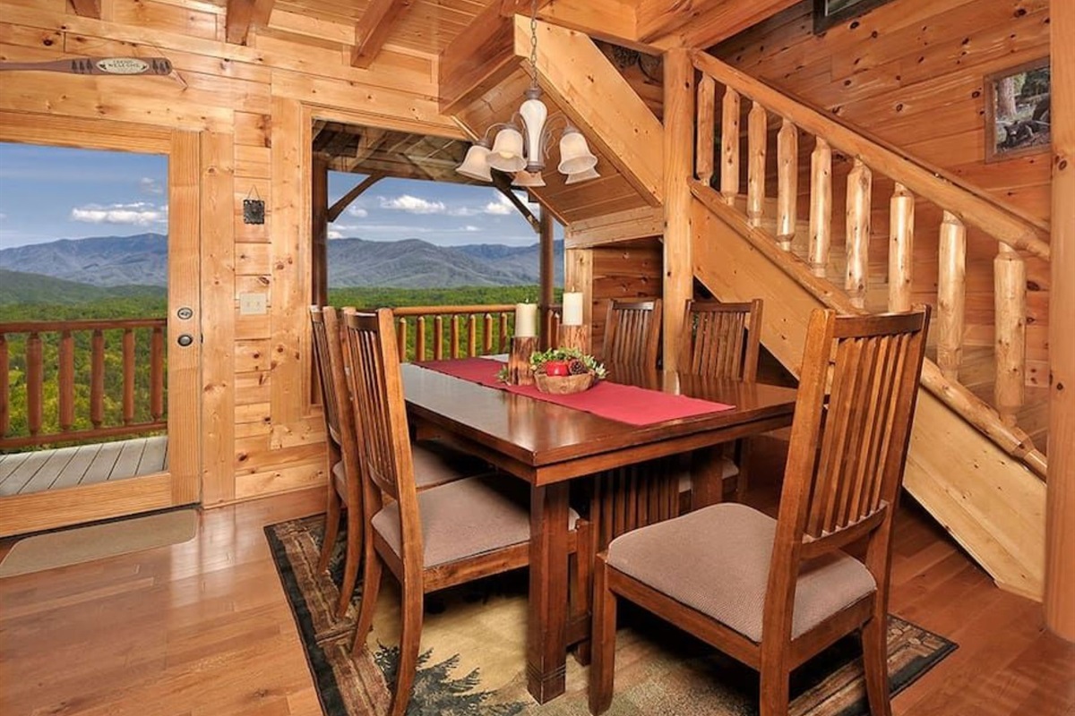 - Rustic dining area with mountain views through every window   - Gather for homemade meals surrounded by natural wood charm   - Enjoy conversations that last as long as the views beyond the deck