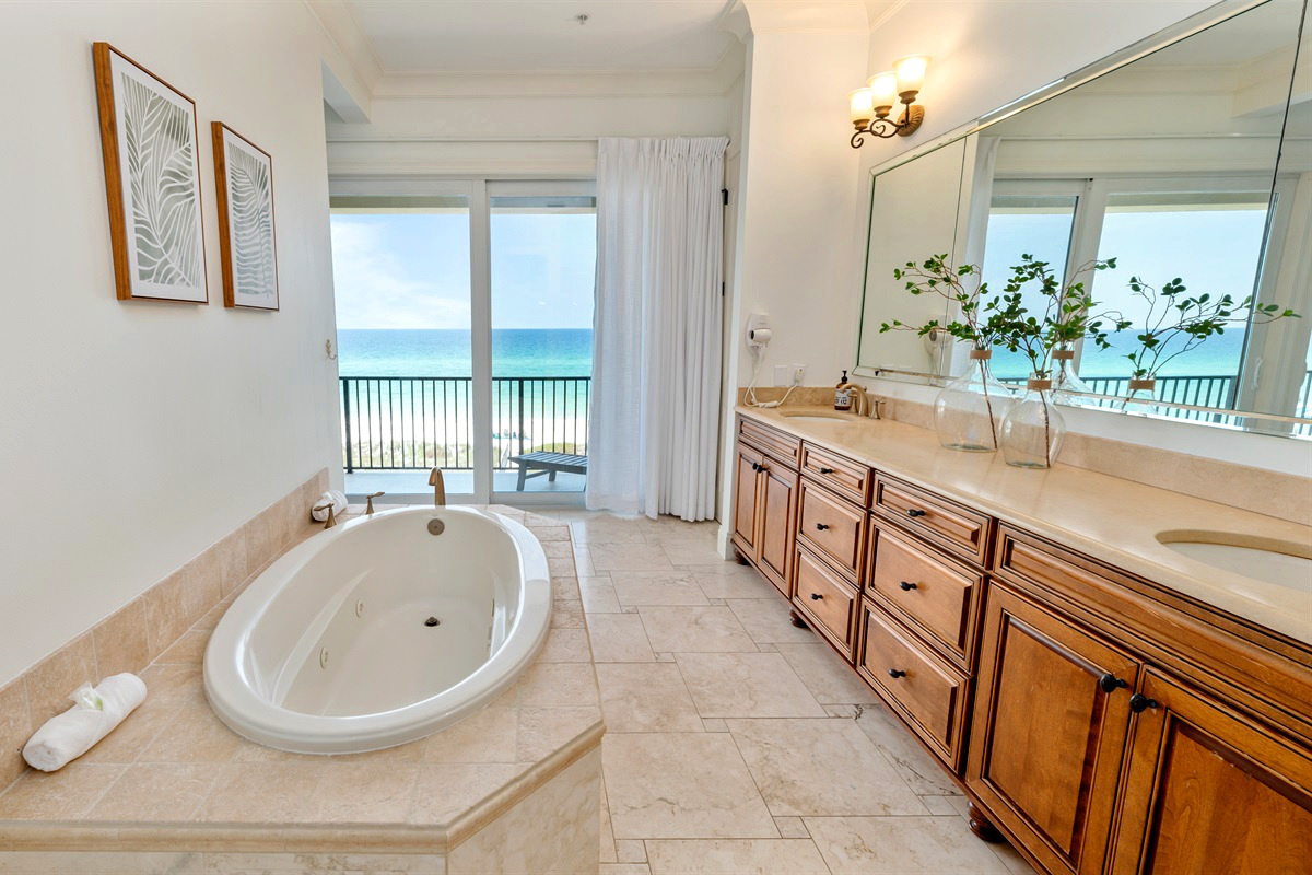 Watch the dolphins swim while you soak