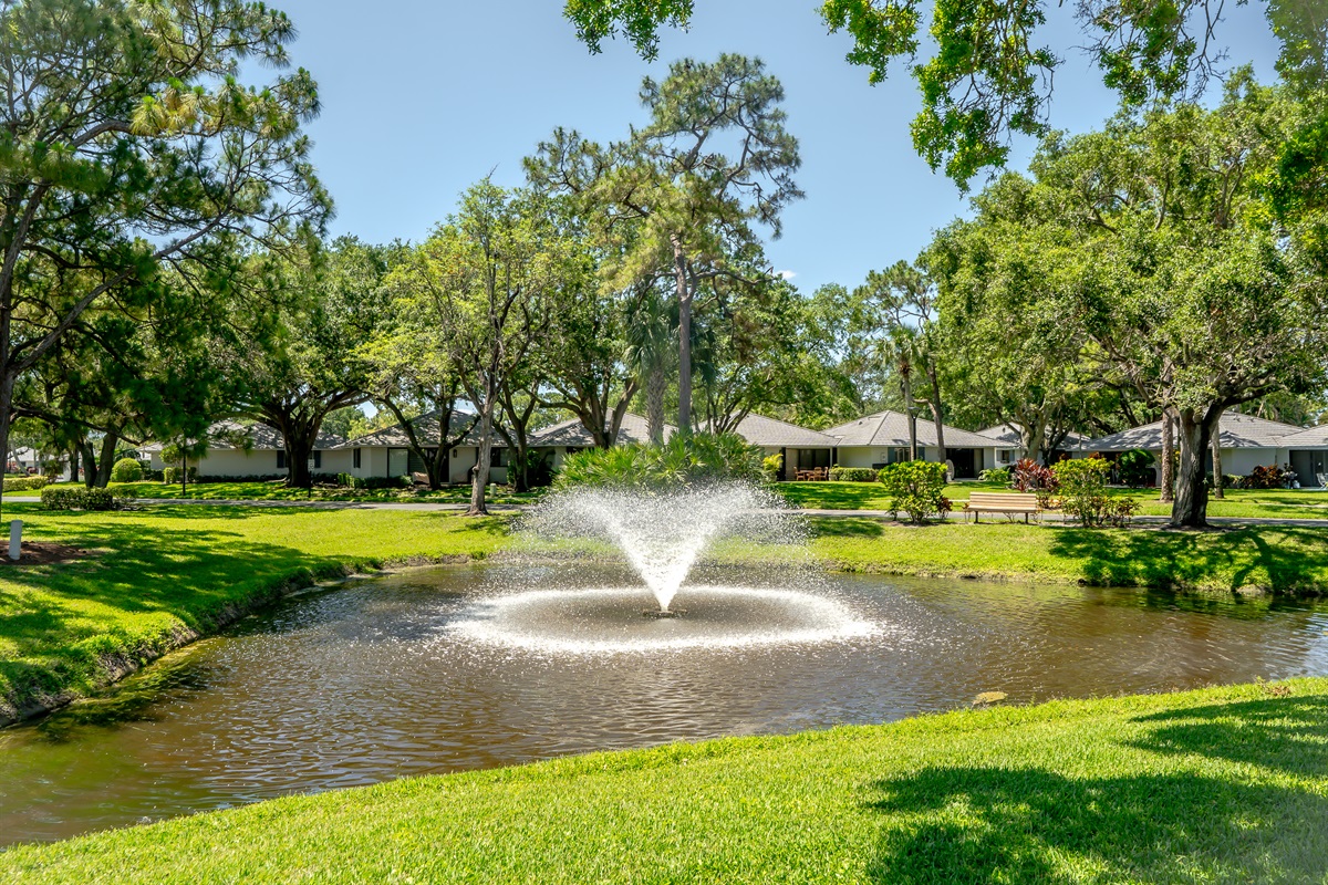 Peaceful lakefront setting with lush tropical landscaping, walking paths, and tranquil fountain views right outside your door.
