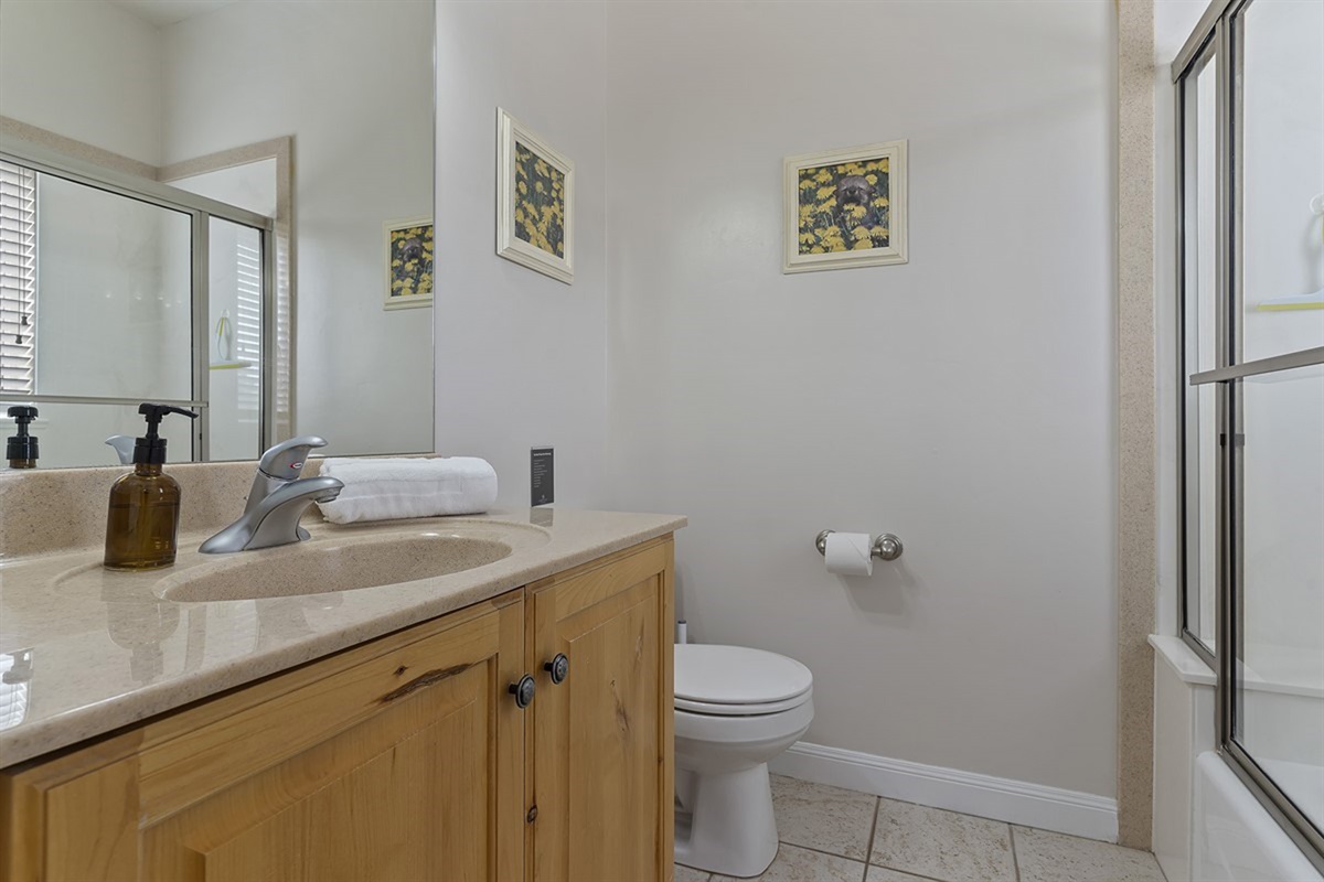 A clean, well-appointed full bathroom with plenty of space to get ready and unwind.
