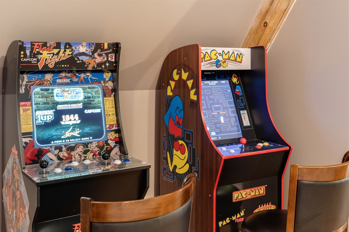 Game room with Pac-Man and Final Flight arcade games, Skee-Ball, Foosball and Air Hockey.