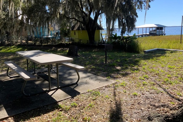 Picnic table and charcoal grill